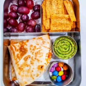 Quesadilla,Guacamole, chips, grapes and chocolate drops