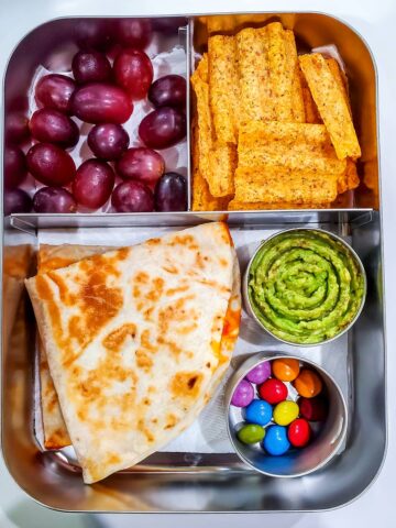 Quesadilla,Guacamole, chips, grapes and chocolate drops