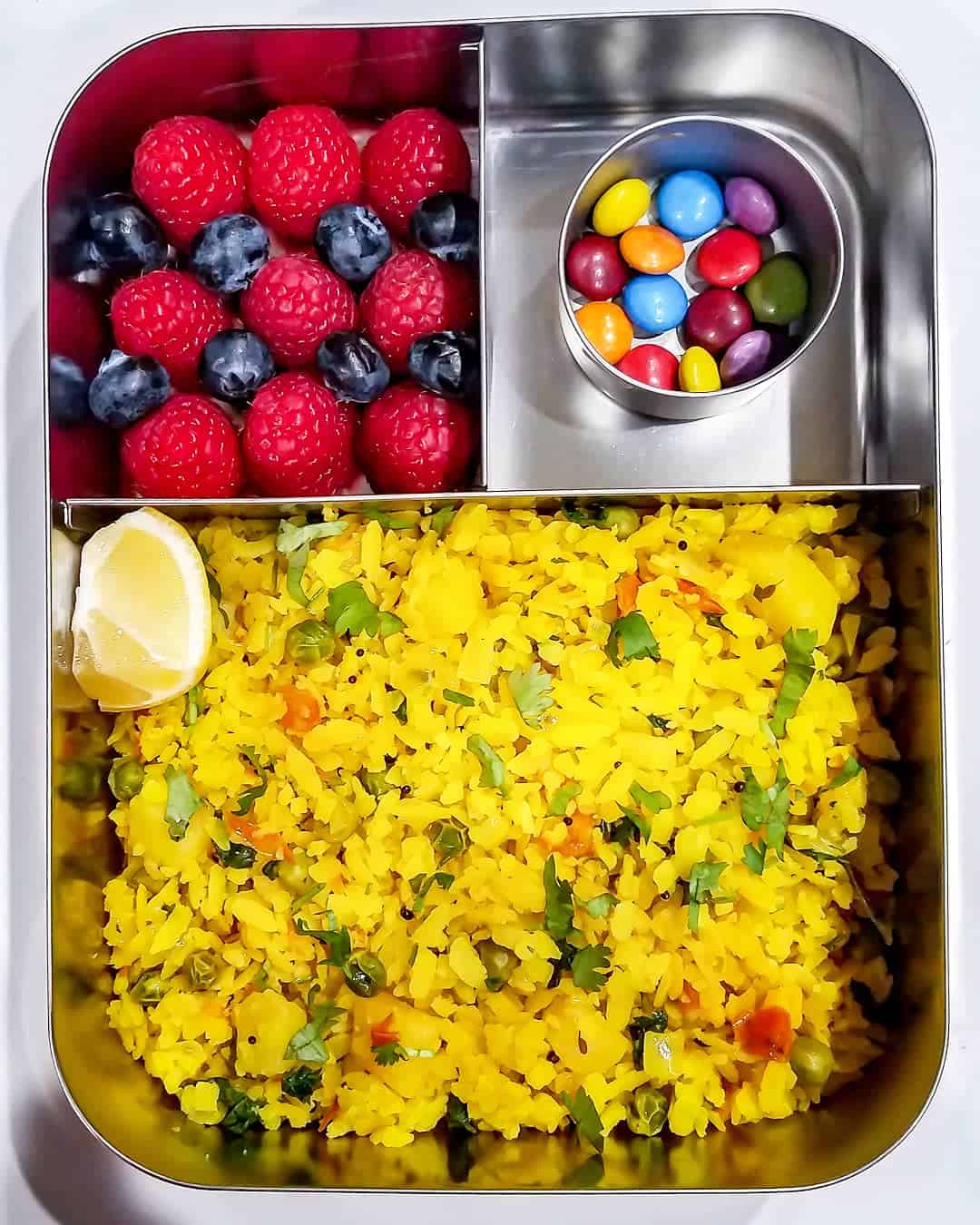 Poha, raspberries and blueberries and chocolate drops