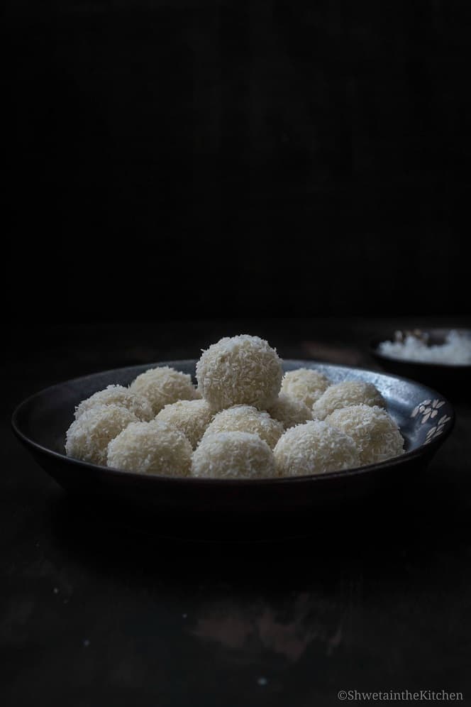Side view of plate full of ladoo