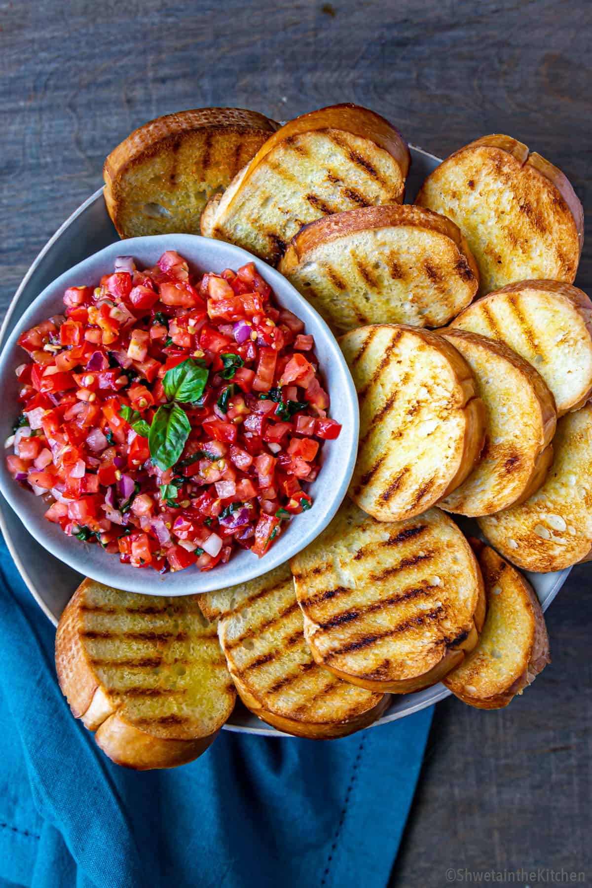 Tomato basil mixture surrounded by grilled bread