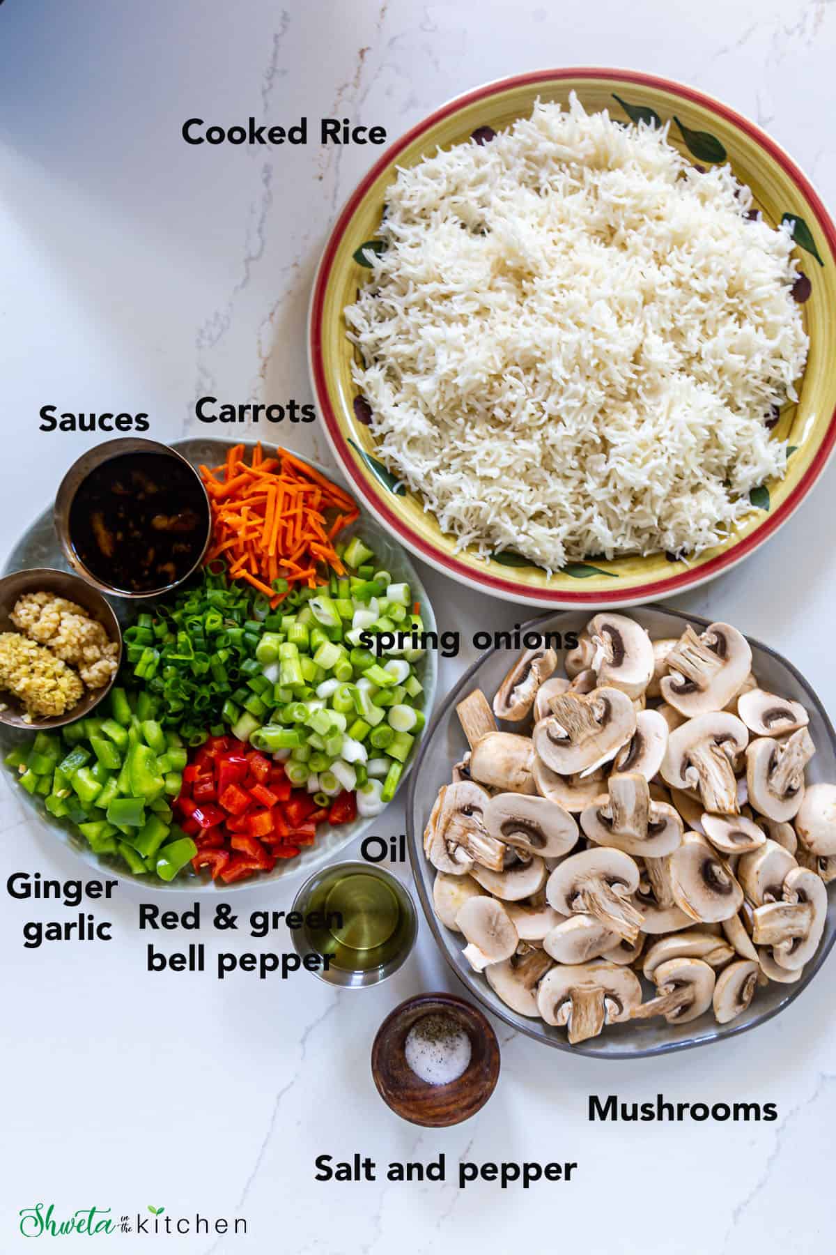 Ingredients for Mushroom Fried Rice laid out on white surface in bowls