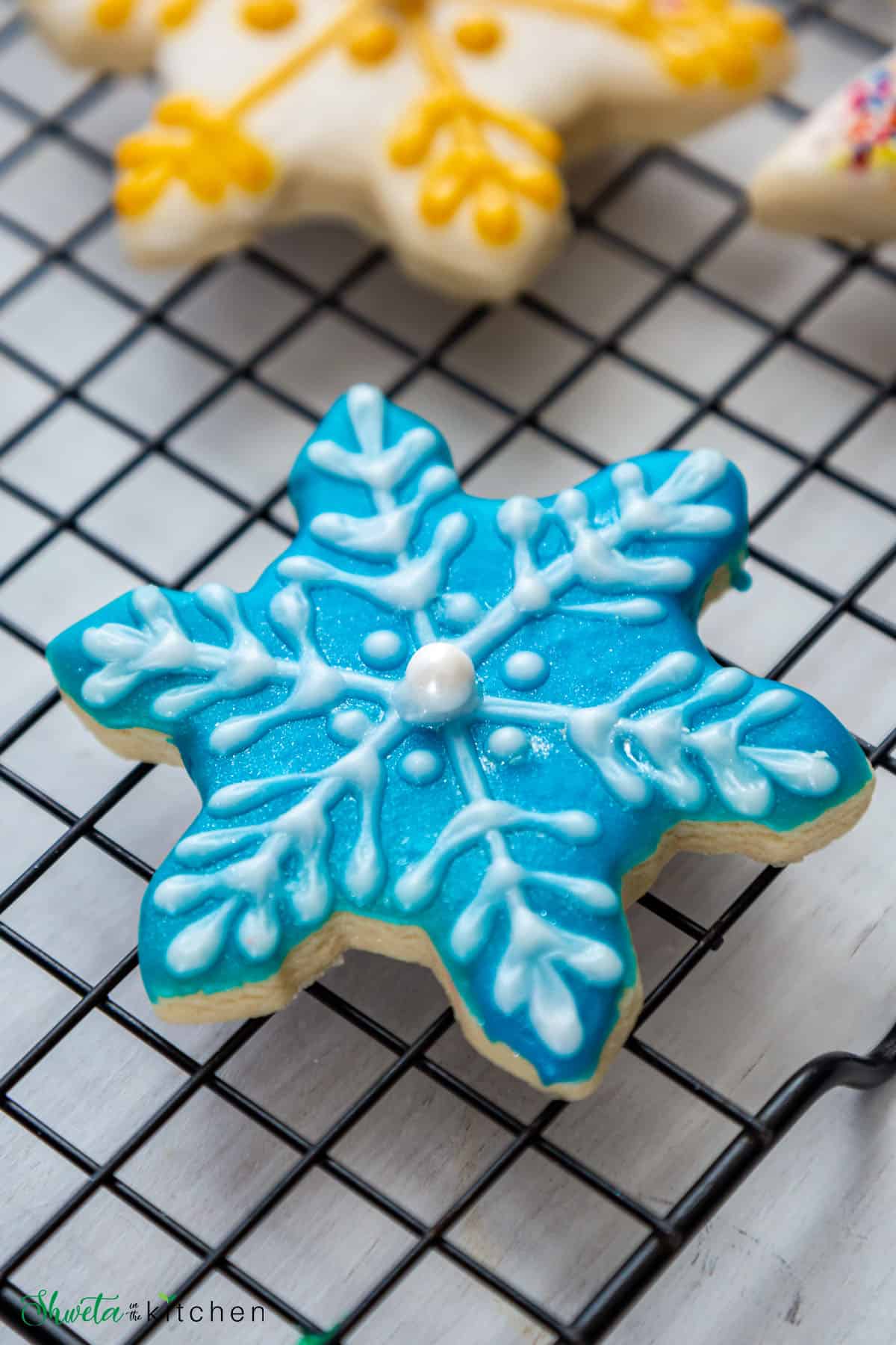 Close up of frosted snowflake sugar cookie