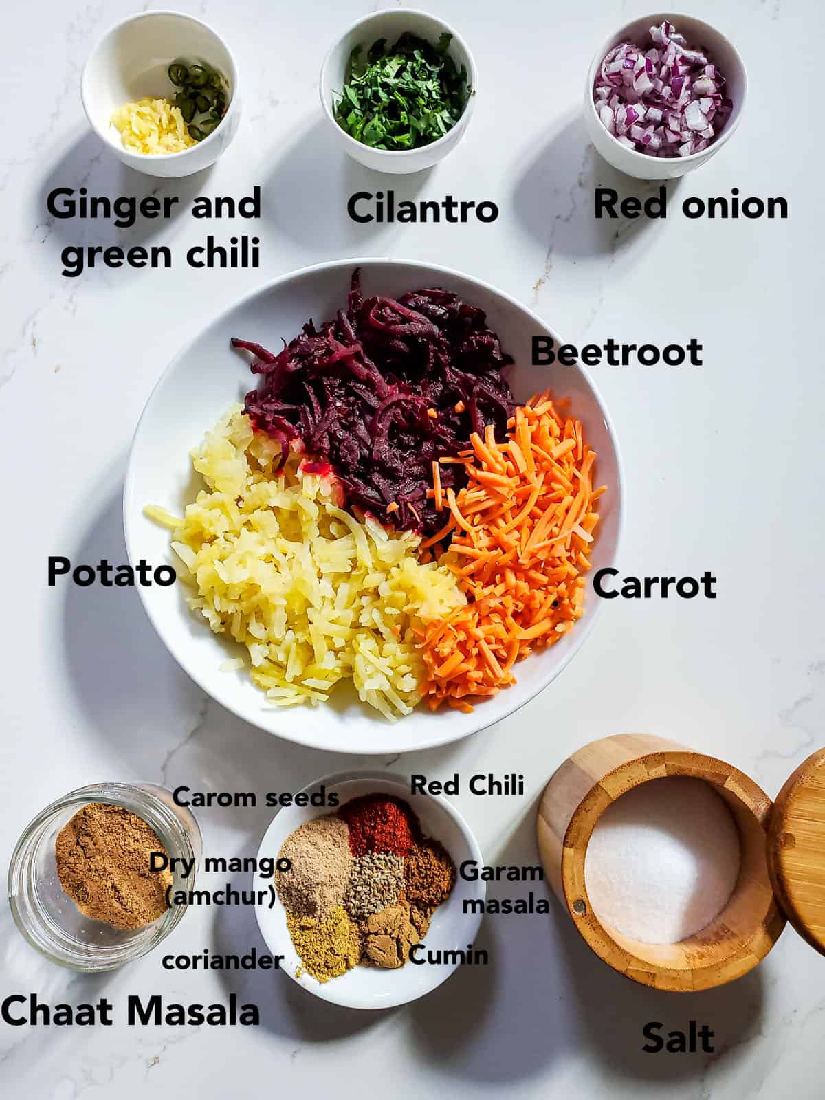 Beetroot Paratha Ingredients in a bowls on white surface