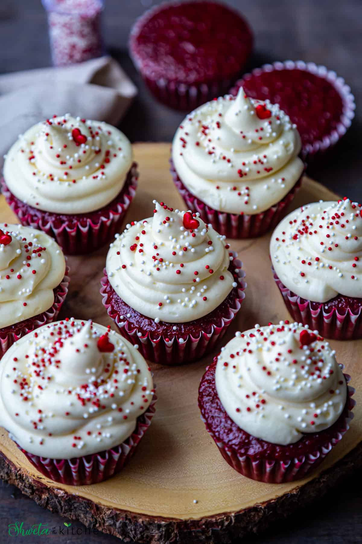 Red Velvet cupcakes on a wooden tray