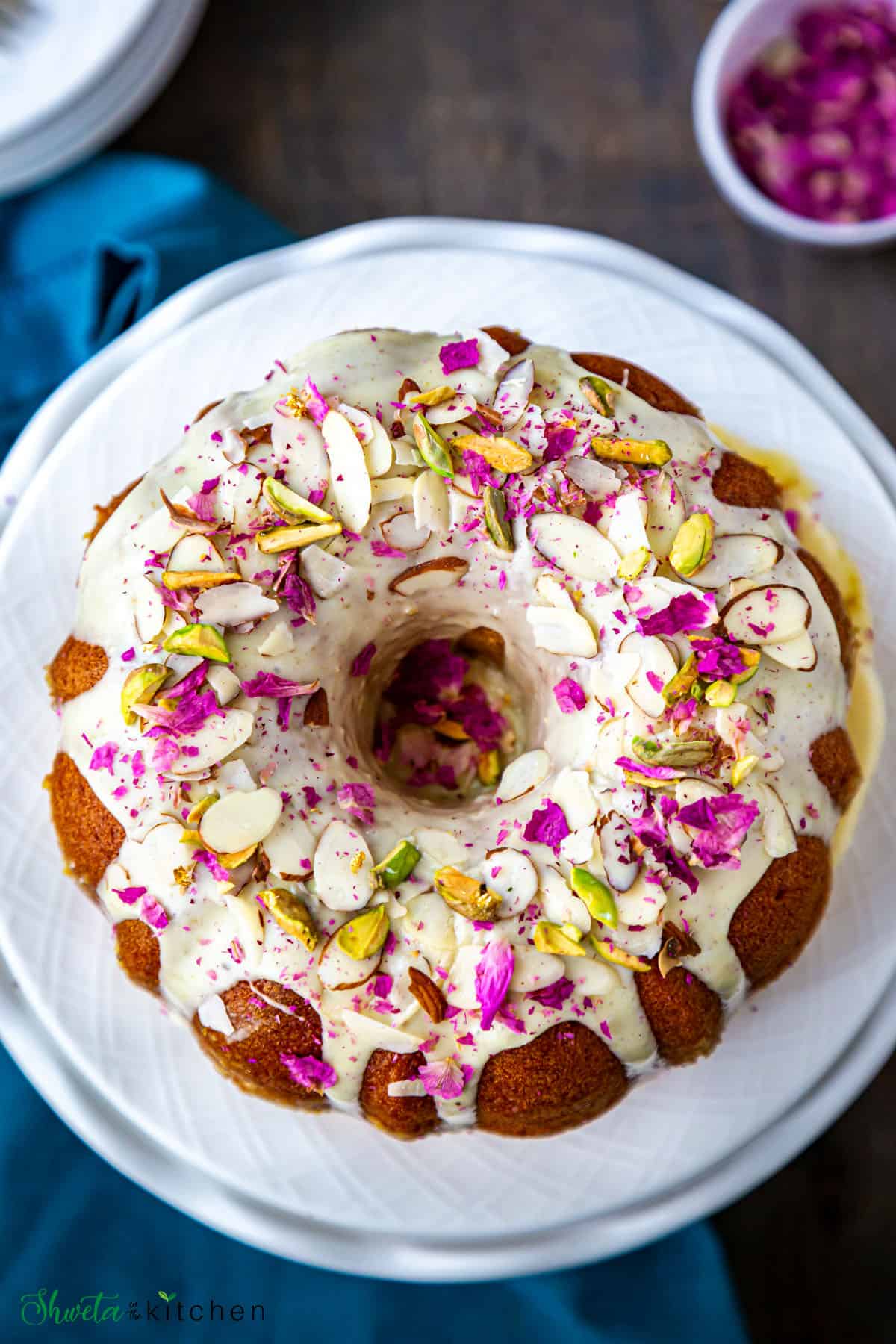 top view of the decorated thandai bundt cake on a plate
