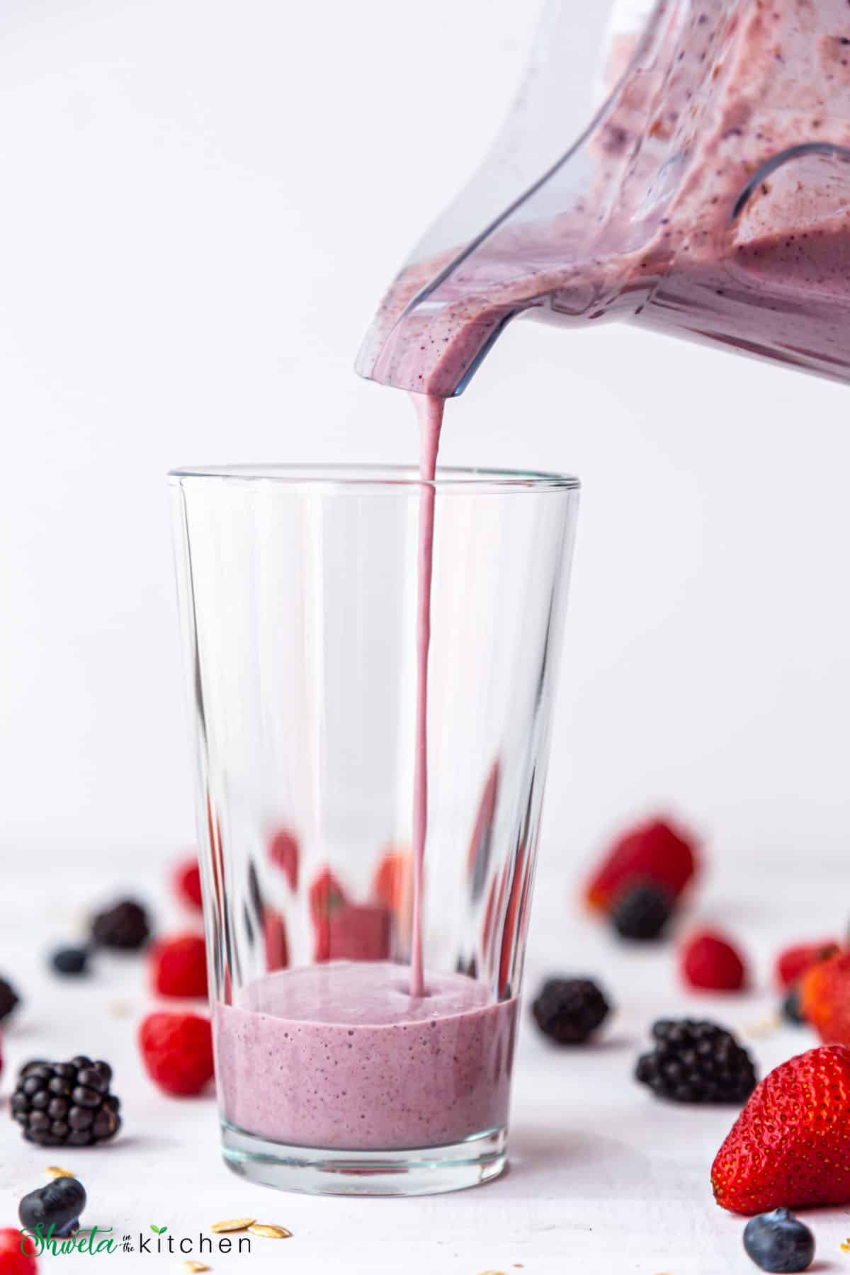 Berry Oatmeal Smoothie being poured into a glass
