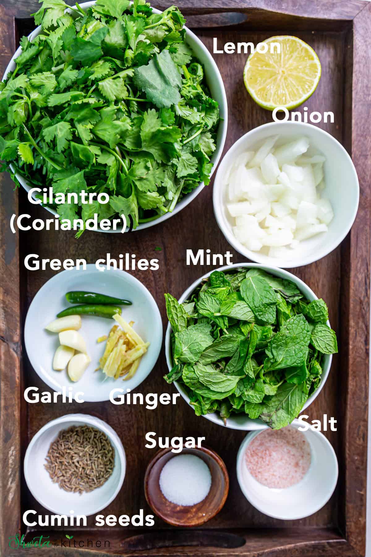 Mint Cilantro Chutney Ingredients in bowls on wooden tray