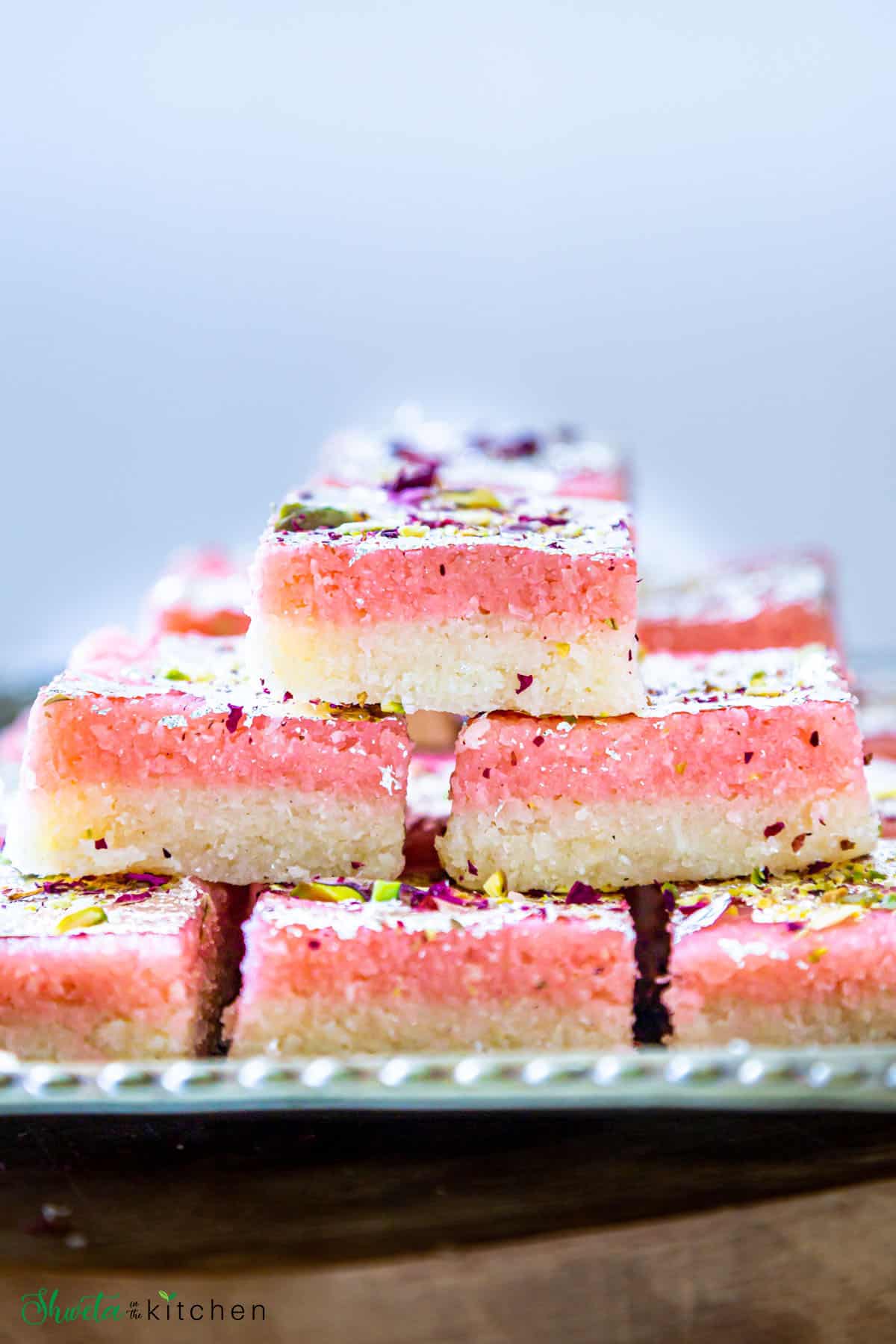 Side view of double layered Coconut barfi showing pink and white layers