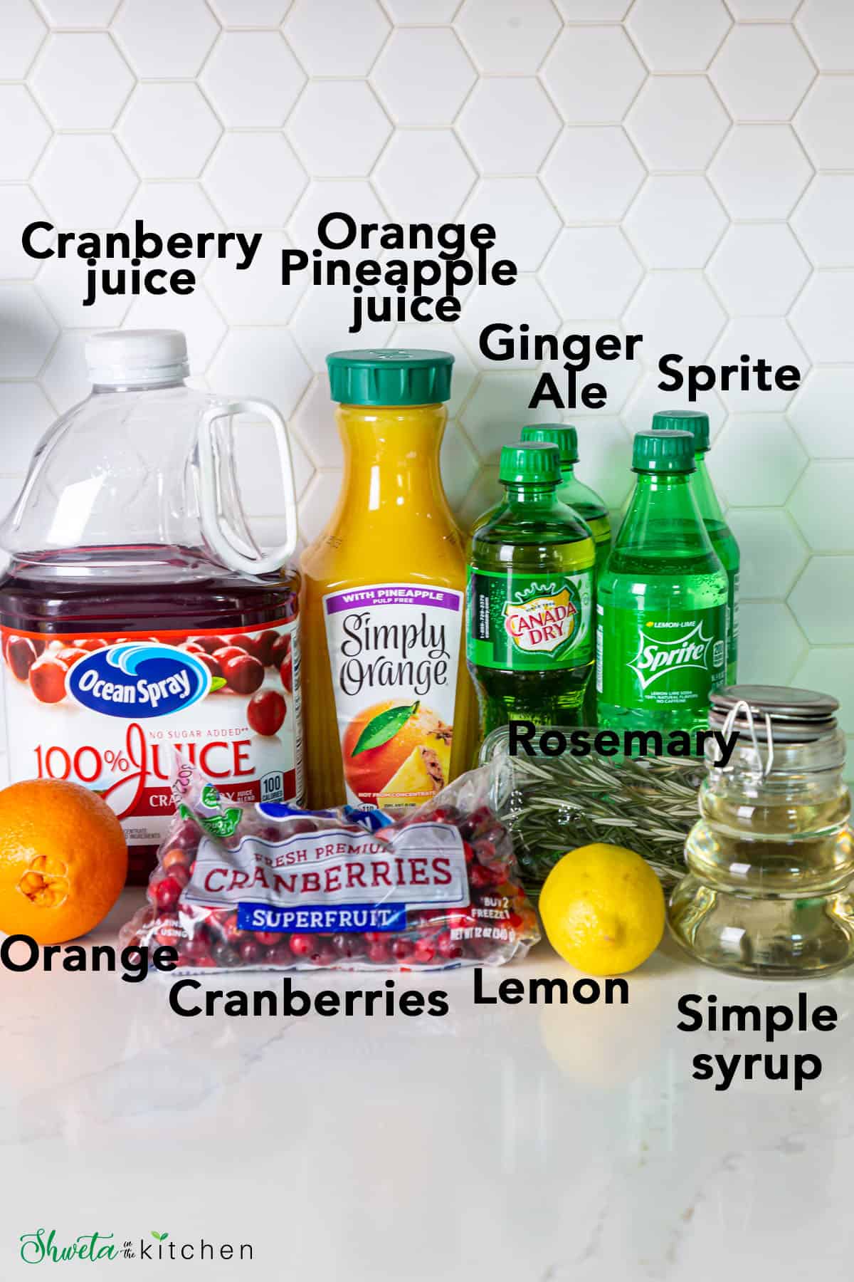 Ingredients for Non Alcoholic Christmas Punch on a white surface with white background 
