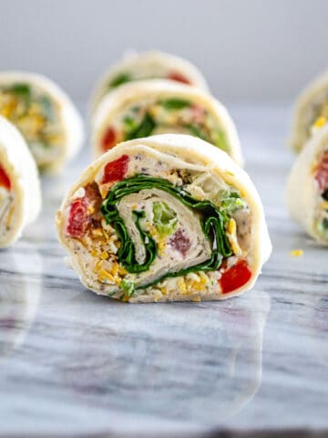 Tortilla pinwheels cut into slices showing the colorful filling