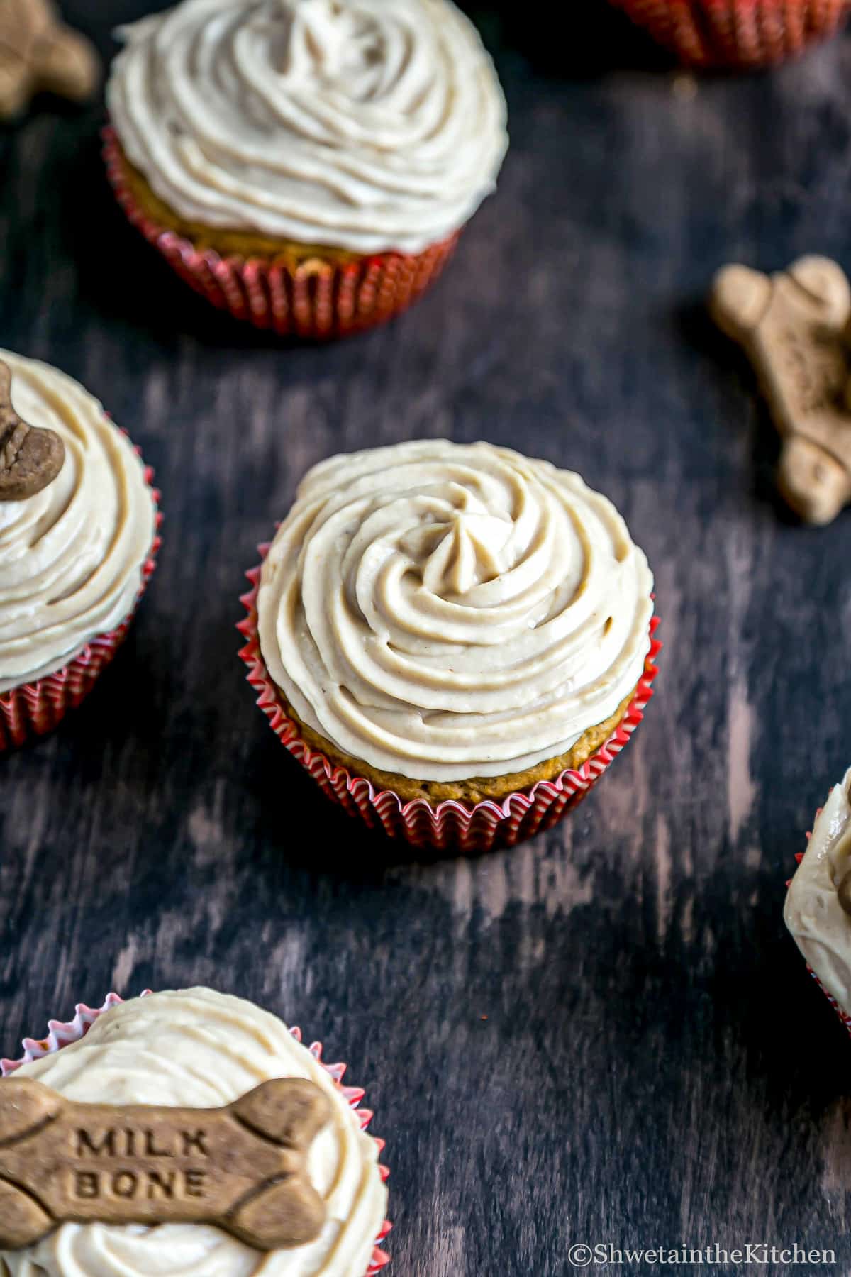 Carrot Peanut Butter Pupcake topped with peanut butter yogurt frosting