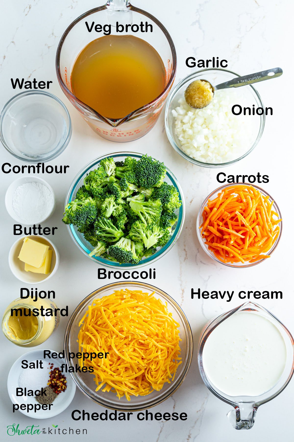 Ingredients for broccoli cheddar soup in bowls on white surface