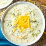 instant pot broccoli cheddar soup in a bowl topped with cheese