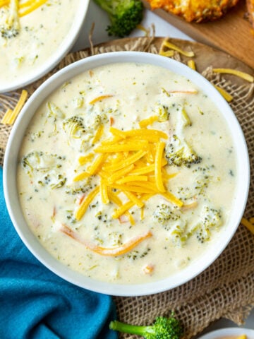 instant pot broccoli cheddar soup in a bowl topped with cheese