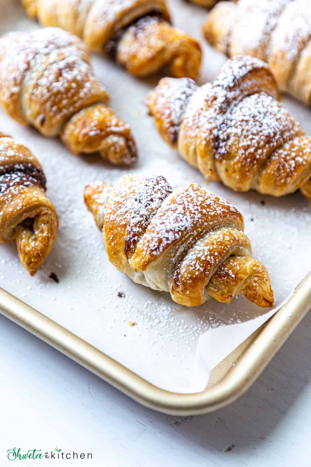 close up of nutella croissant with powdered sugar