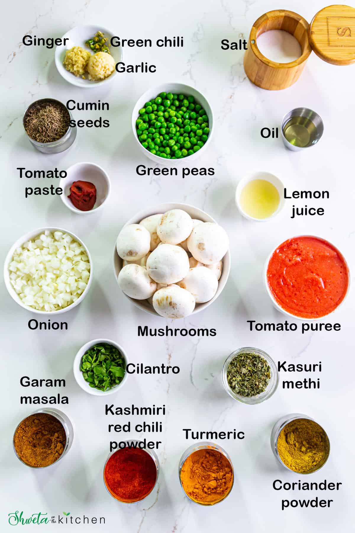 Ingredients for Mushroom matar placed in bowls on white surface