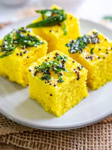 4 pieces of instant khaman dhokla on a plate