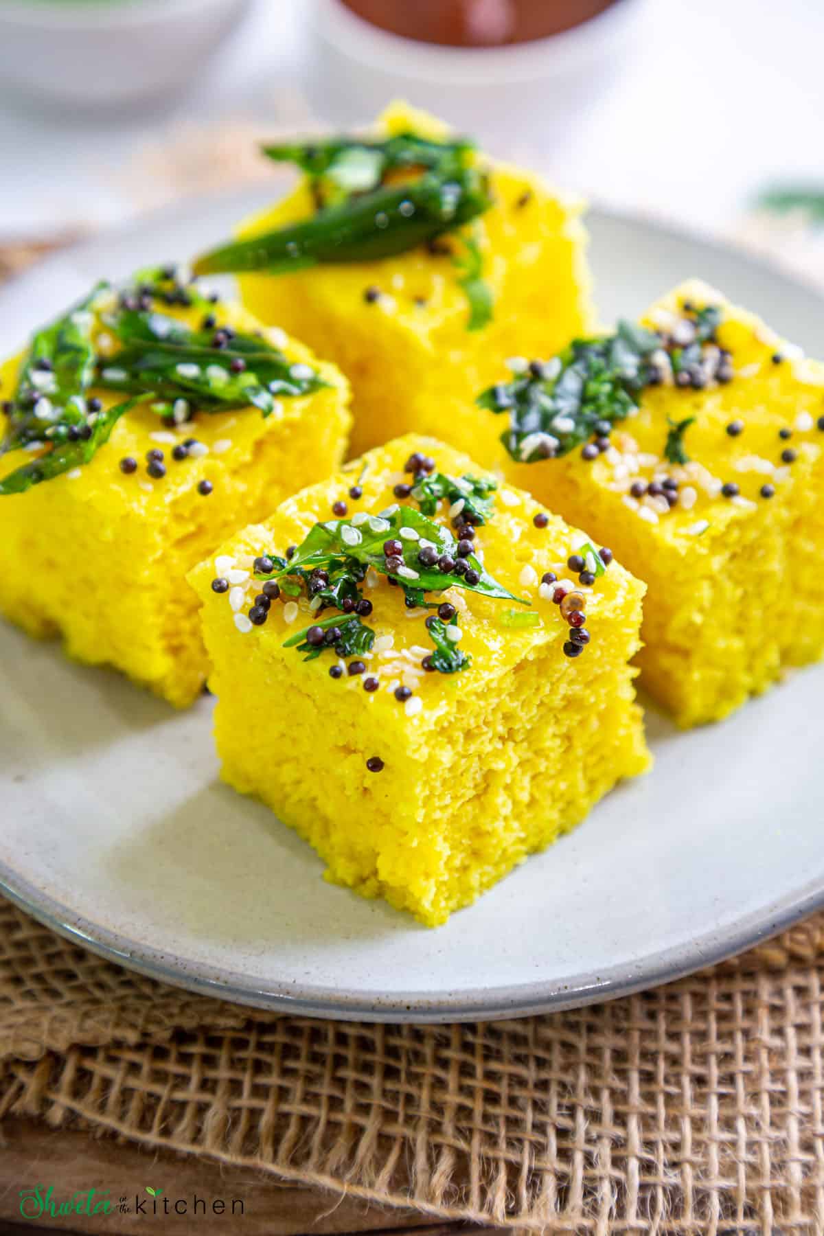 4 pieces of instant khaman dhokla on a plate