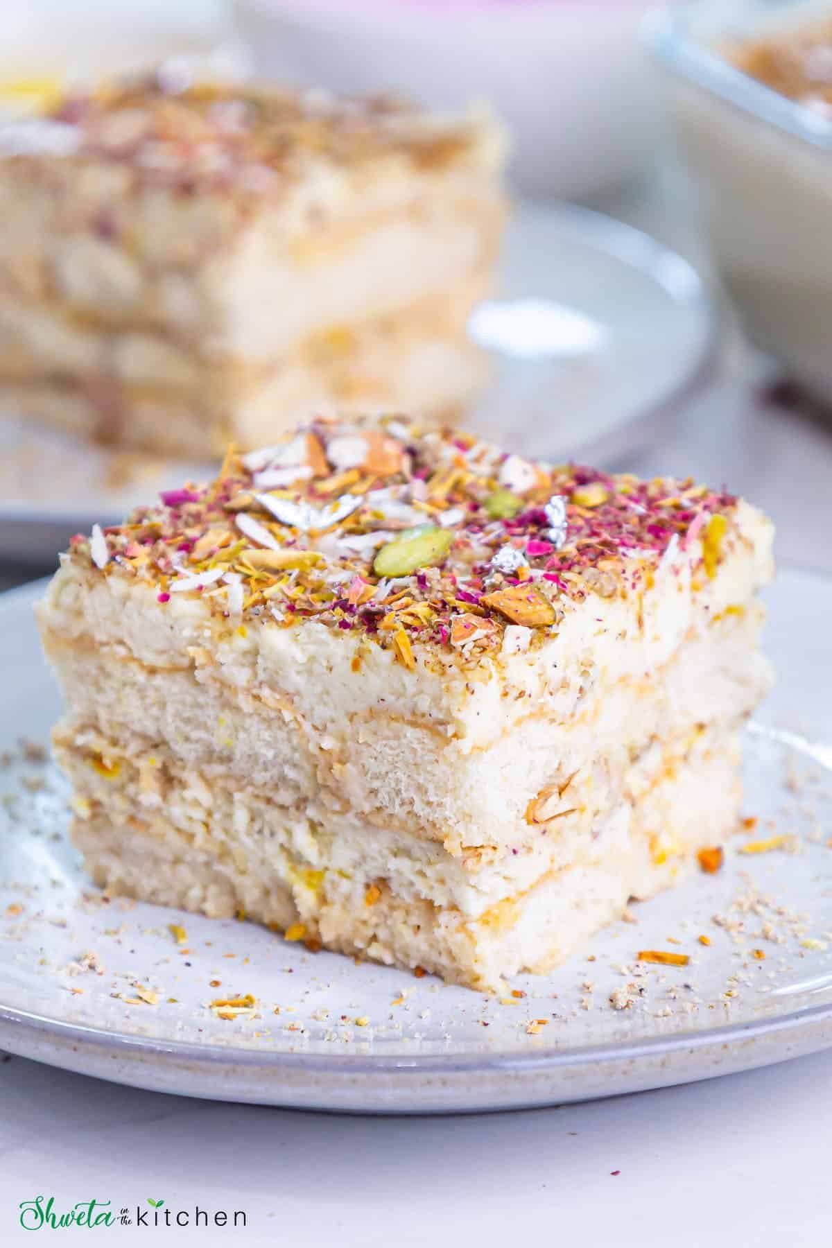 Slice of thandai tiramisu place sideways on a plate